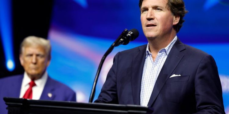 Tucker Carlson says father Trump will give ‘spanking’ at rowdy Georgia rally